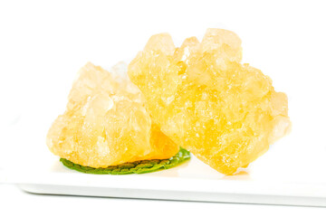 Handmade Yellow Rock Candy Crystals - Traditional Large Grain Sweet Confection on White Background