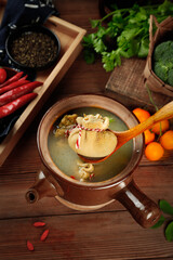 Fresh Pork Belly Soup in Clay Pot with Vegetables - Traditional Mongolian Asian Cuisine