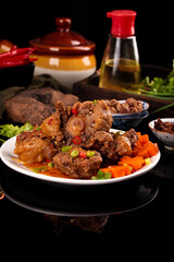 Fresh Braised Oxtail Beef Stew with Bones and Carrots on White Plate