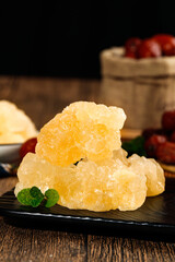 Handmade Yellow Rock Candy Crystals with Mint on Rustic Wooden Table - Sweet Confectionery Display