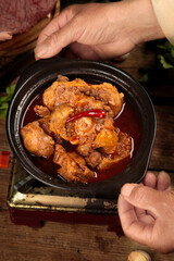 Spicy beef tail stew in stone pot - traditional Asian braised oxtail dish with rich sauce and fresh ingredients