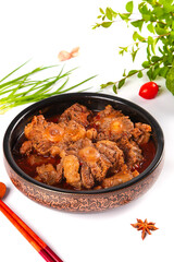 Traditional Braised Beef Oxtail Stew in Ceramic Bowl with Fresh Herbs and Spices