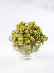 Dried Green Cauliflower Florets in Glass Bowl on White Background