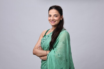 Smiling Woman in Green Saree Poses for Capture
