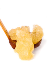 Large Yellow Rock Sugar Chunks on Wooden Spoon - Natural Crystalline Sweetener
