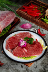Fresh Raw Beef Steaks with Vegetables and Herbs Culinary Presentation