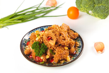 Fresh Beef Tripe Stir Fry Dish with Vegetables and Herbs on Traditional Plate