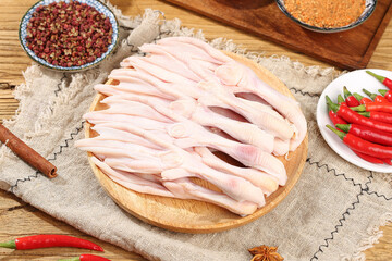 Fresh Raw Duck Feet on Wooden Board with Spices and Red Chili Peppers - Premium Poultry Ingredient
