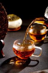Ancient Puerh Tea Cake with Glass Teapot Pouring Traditional Chinese Tea Ceremony