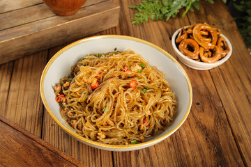 Traditional Vermicelli Noodles with Chutney and Sweet Potato Chips on Wooden Table