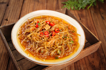 Asian Stir-Fried Vermicelli Noodles with Chili Peppers and Herbs on Wooden Table