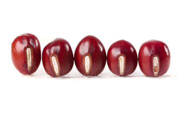 Red kidney beans halved showing seeds on white background - nutritious vegetarian protein ingredient