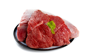 Fresh Raw Beef Cuts with Marbled Texture on Black Plate Isolated on White Background