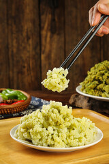 Crispy Dried Sichuan Cauliflower Being Served with Chopsticks - Asian Vegetable Dish
