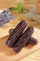 Purple Glutinous Corn from Xishuangbanna Yunnan China on Wooden Base