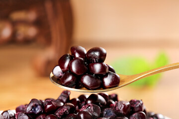 Black Glutinous Corn from Xishuangbanna Yunnan China on Wooden Spoon - Traditional Asian Superfood Ingredient