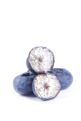 Fresh Yunnan Blueberries Cut in Half Showing White Flesh on White Background