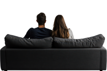 Couple enjoys quiet moment together on couch, embracing connection and intimacy while sharing their favorite leisure time at home