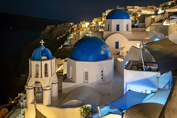 Santorini, Greece - Picturesque 3 blue church domes at night