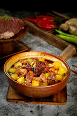Chinese Braised Beef and Potato Stew in Clay Bowl - Traditional Asian Comfort Food Dish