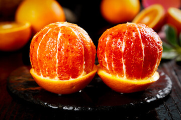 Zizhong Blood Oranges from Sichuan China - Sweet Deep Red Citrus Fruit Halves on Dark Wood