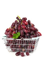 Fresh Red Grapes in Shopping Basket with Mint Leaf on White Background