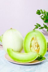 Fresh Jade Green Honeydew Melon Slices with Mint on White Plate - Sweet Summer Fruit