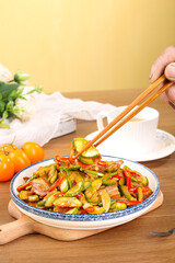 Stir-fried zucchini and mixed vegetables on plate with chopsticks - healthy Asian cooking