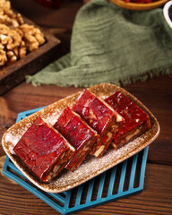 Xinjiang Red Date Walnut Pie Slices Traditional Chinese Dessert on Wooden Table