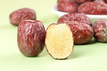 Ruoqiang Red Dates Jujube Fruits from Xinjiang China Whole and Cut Halves Showing Golden Interior