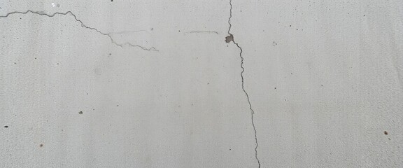 Obraz premium Raw, textured concrete floor, showing aggregate and subtle imperfections, wall, seamless