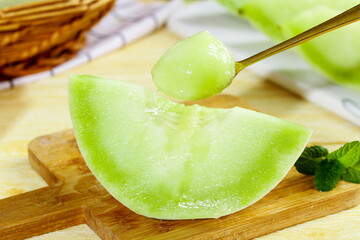 Fresh Honeydew Melon Slice with Cubes on Wooden Board - Healthy Summer Fruit Snack