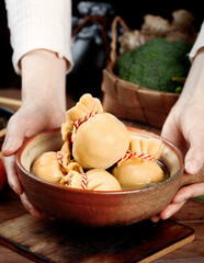 Raw Pork Belly Wrapped with String in Wooden Bowl - Traditional Cooking Preparation