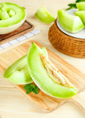 Fresh Jade Green Melon Slices on Wooden Cutting Board - Healthy Summer Fruit from Shandong