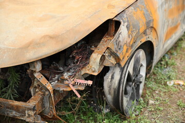 Abandoned Burnt Car Wreck on Mountain Roadside