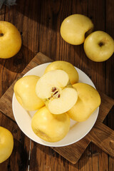 Fresh Yantai Fuji Apples Display on Wooden Table with Sliced Apple Showing Cream Flesh