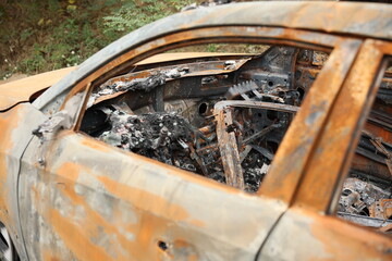 Abandoned Burnt Car Wreck on Mountain Roadside