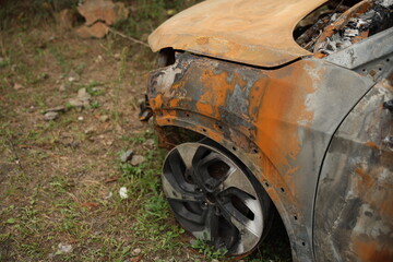 Abandoned Burnt Car Wreck on Mountain Roadside