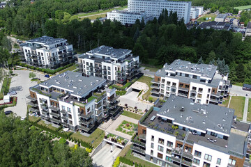 Aerial view modern low-rise apartment buildings surrounded by greenery