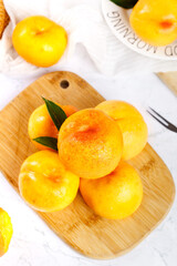 Fresh Golden Yimeng Mountain Nectarines on Wooden Board - Ripe Stone Fruit Display