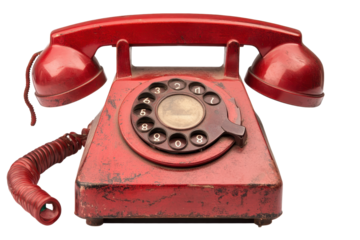 Vintage red telephone receiver on a white background showcasing its classic design and retro features with noticeable wear and history