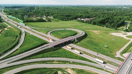 Cars and trucks driving on countryside road