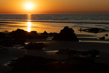 A magical golden sunset along a beach in the far north of Western Australia.