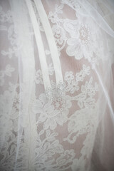 Close-Up of Lace Wedding Veil with Ribbon and Crystal Detail