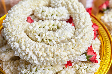 Close-up of jasmine garland for offerings to pay respect god on plate © Cavan