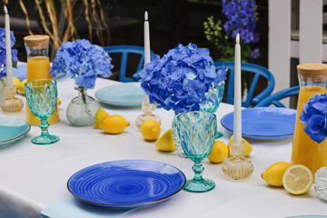 Elegant outdoor table setting with blue and turquoise accents