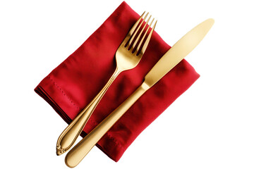 Christmas dinner table setting featuring elegant gold cutlery on a festive red napkin for a warm holiday celebration with family and friends