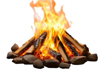 Cozy bonfire burns brightly, providing warmth and light during a tranquil evening outdoors with logs and stones arranged around the fire
