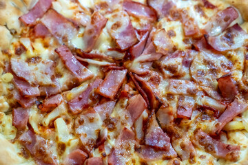 Close up of bacon and cheese pizza