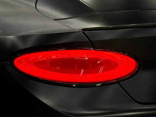 LED taillights of a modern SUV car in close-up. Taillight or rear light of modern sport car in...